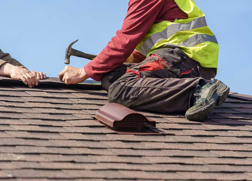professionals performing routine roof maintenance