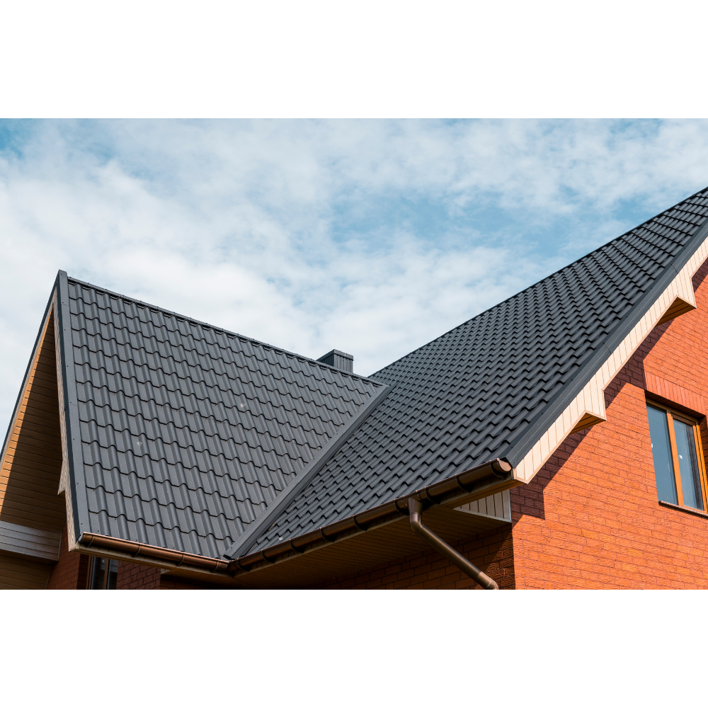 Metal Roofing Contractors in Las Vegas: a metal roof on a brick home
